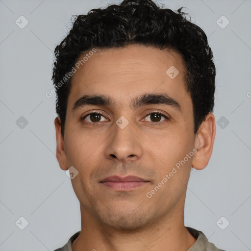 Neutral latino young-adult male with short  black hair and brown eyes
