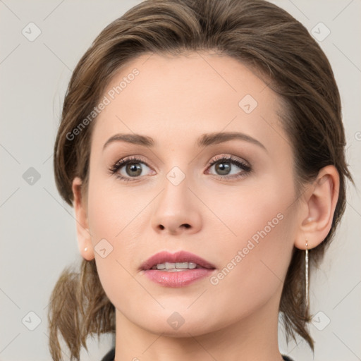 Joyful white young-adult female with medium  brown hair and green eyes