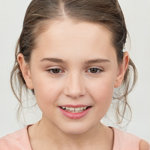 Joyful white child female with medium  brown hair and brown eyes