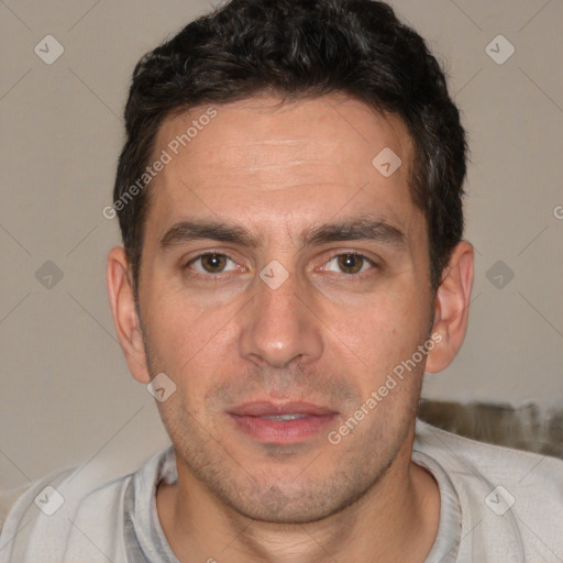 Joyful white adult male with short  brown hair and brown eyes