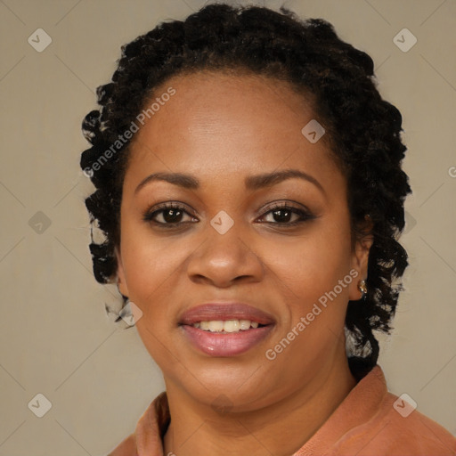 Joyful black young-adult female with long  brown hair and brown eyes