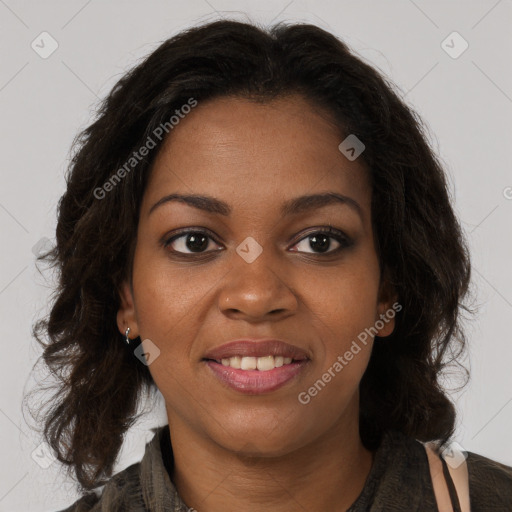 Joyful black young-adult female with long  brown hair and brown eyes