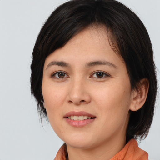 Joyful white young-adult female with medium  brown hair and brown eyes