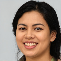 Joyful asian young-adult female with medium  brown hair and brown eyes