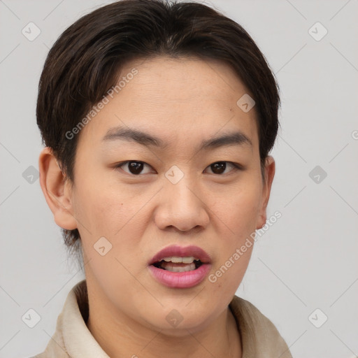 Joyful asian young-adult male with short  brown hair and brown eyes