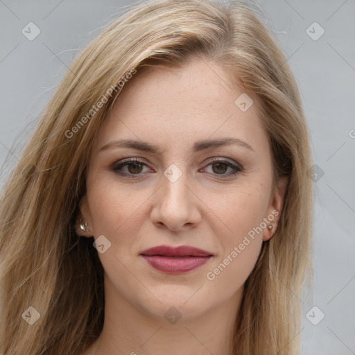 Joyful white young-adult female with long  brown hair and brown eyes