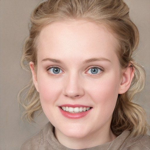 Joyful white young-adult female with medium  brown hair and blue eyes