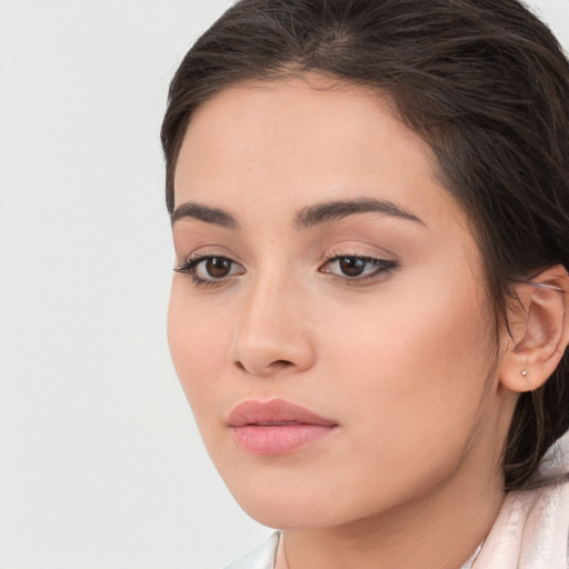 Neutral white young-adult female with long  brown hair and brown eyes