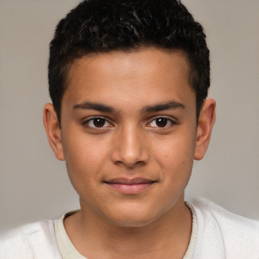 Joyful latino child male with short  brown hair and brown eyes