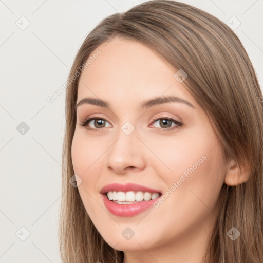 Joyful white young-adult female with long  brown hair and brown eyes