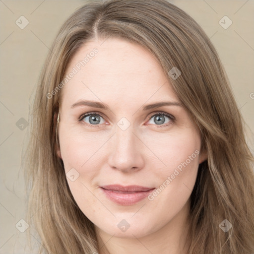 Joyful white young-adult female with long  brown hair and green eyes