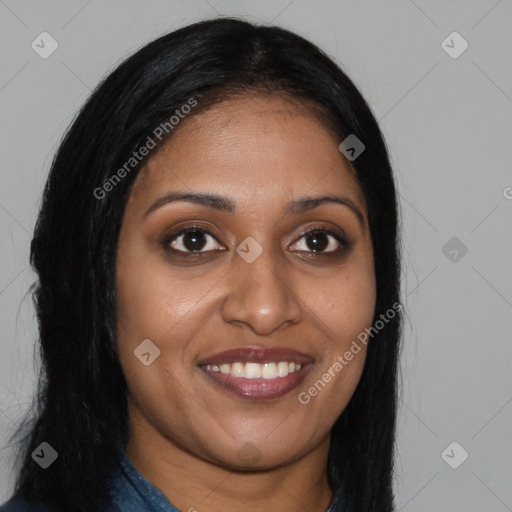 Joyful black young-adult female with long  brown hair and brown eyes