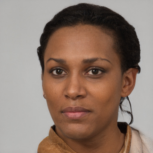 Neutral black young-adult female with short  brown hair and brown eyes