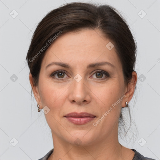 Joyful white adult female with medium  brown hair and grey eyes