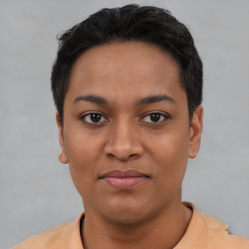 Joyful latino young-adult female with short  black hair and brown eyes