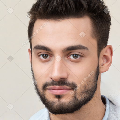 Neutral white young-adult male with short  brown hair and brown eyes