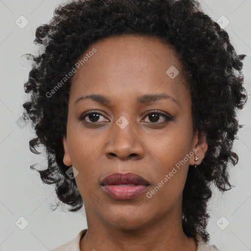 Neutral black adult female with medium  brown hair and brown eyes