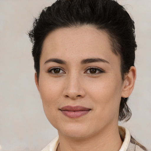 Joyful white young-adult female with short  brown hair and brown eyes