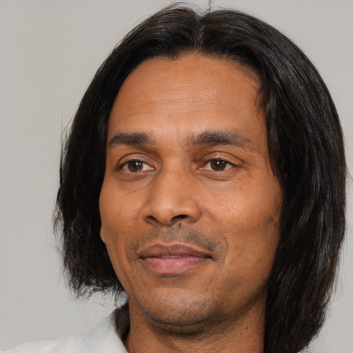 Joyful asian adult male with medium  black hair and brown eyes