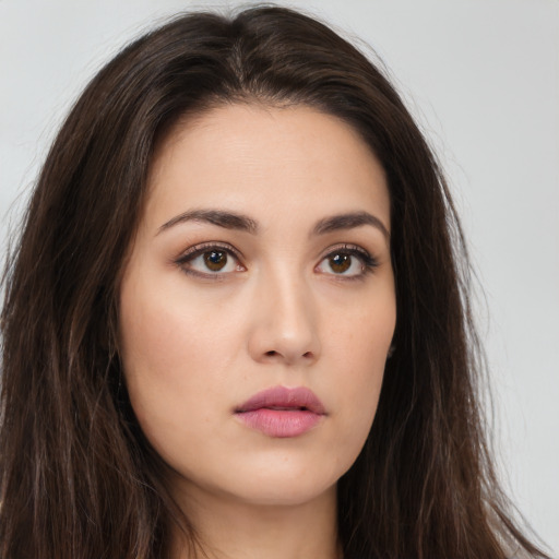 Neutral white young-adult female with long  brown hair and brown eyes