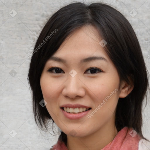 Joyful asian young-adult female with medium  black hair and brown eyes