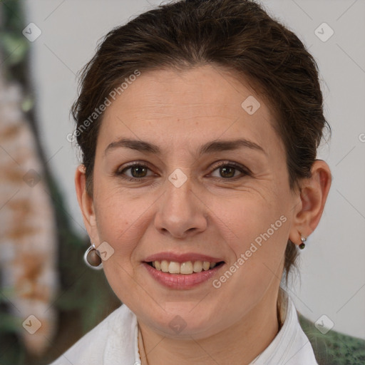 Joyful white adult female with short  brown hair and brown eyes