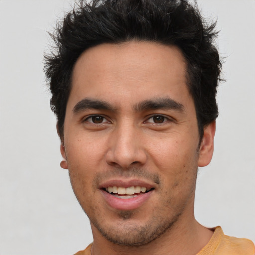 Joyful asian young-adult male with short  brown hair and brown eyes