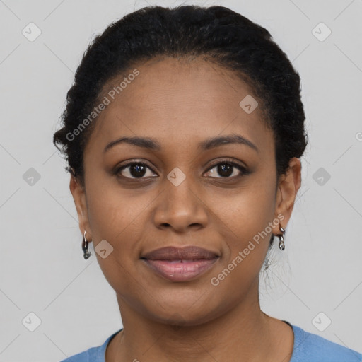 Joyful black young-adult female with short  black hair and brown eyes