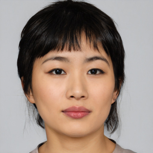 Neutral asian young-adult female with medium  black hair and brown eyes