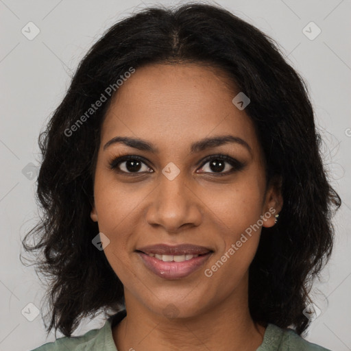 Joyful black young-adult female with long  brown hair and brown eyes