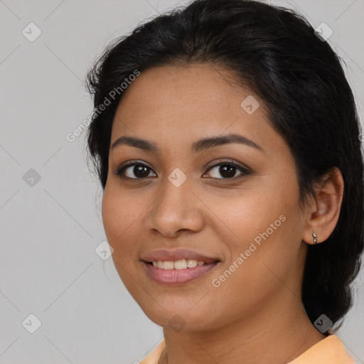 Joyful latino young-adult female with medium  brown hair and brown eyes