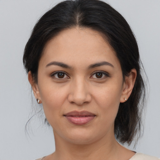 Joyful asian young-adult female with medium  brown hair and brown eyes