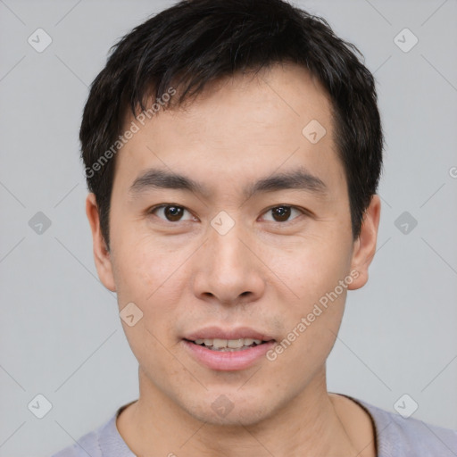 Joyful white young-adult male with short  black hair and brown eyes