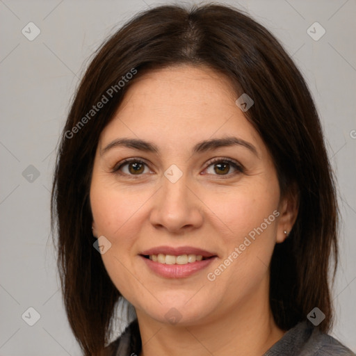 Joyful white adult female with medium  brown hair and brown eyes