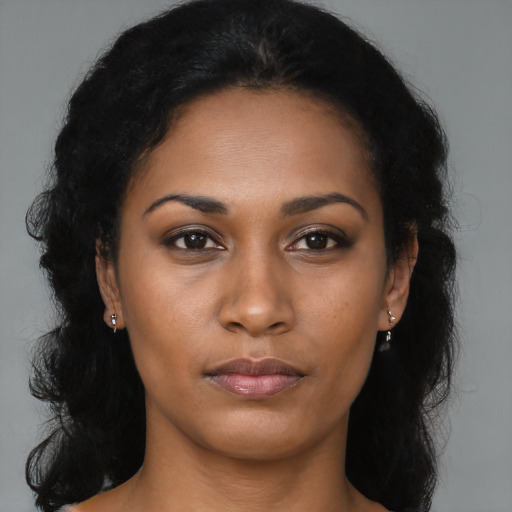 Neutral black young-adult female with long  brown hair and brown eyes