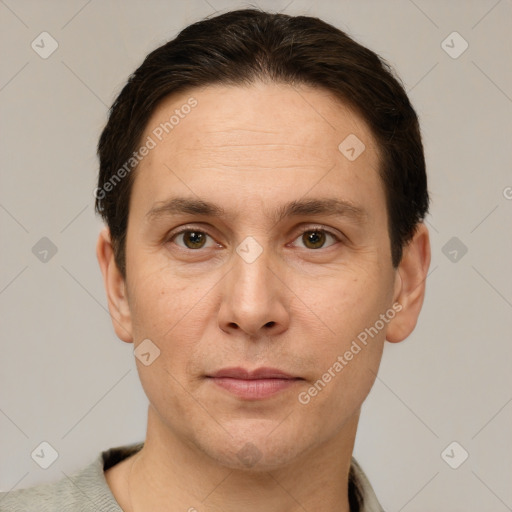 Joyful white adult male with short  brown hair and brown eyes