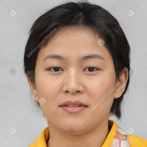 Joyful asian young-adult female with short  brown hair and brown eyes