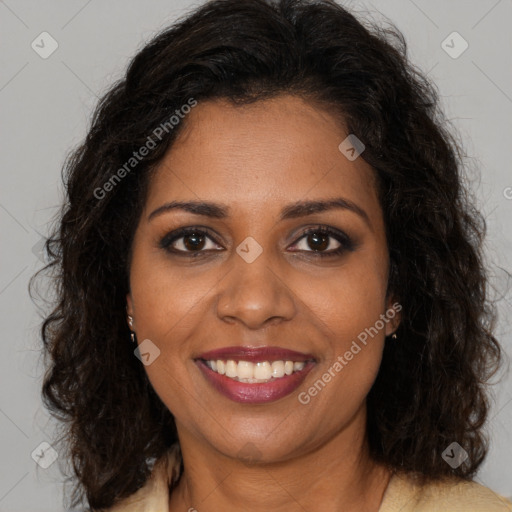 Joyful black young-adult female with long  brown hair and brown eyes