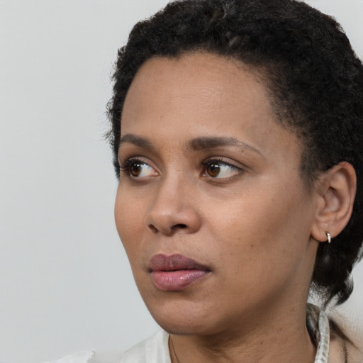Neutral black young-adult female with short  black hair and brown eyes