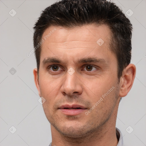 Joyful white adult male with short  brown hair and brown eyes