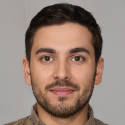 Joyful white young-adult male with short  brown hair and brown eyes