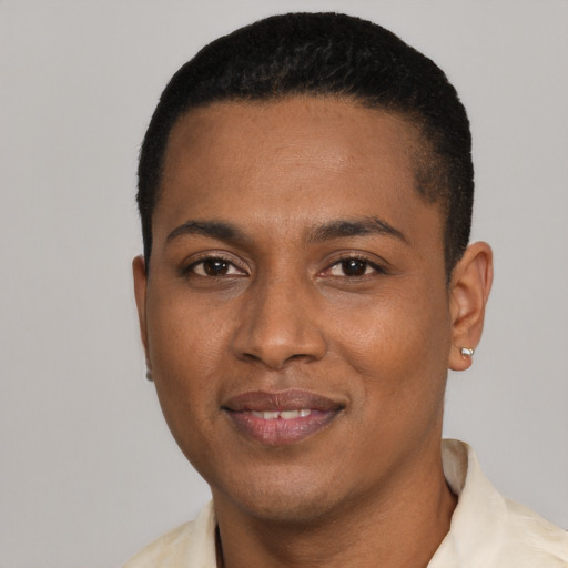 Joyful black young-adult male with short  black hair and brown eyes