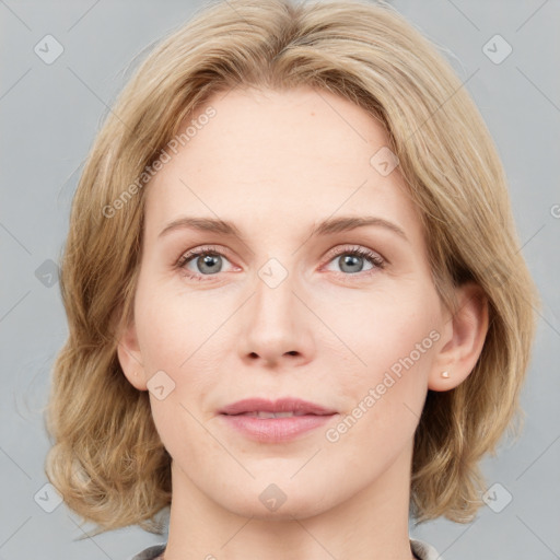 Joyful white young-adult female with medium  brown hair and blue eyes