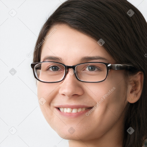 Joyful white young-adult female with long  brown hair and brown eyes