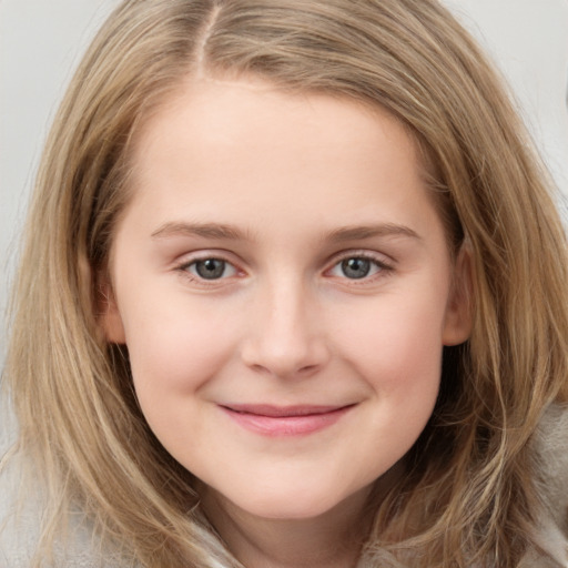 Joyful white child female with long  brown hair and brown eyes