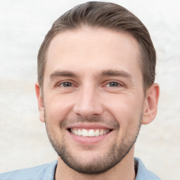 Joyful white young-adult male with short  brown hair and brown eyes