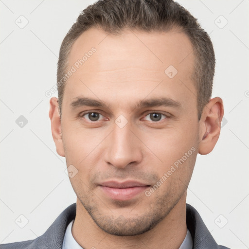 Joyful white young-adult male with short  brown hair and brown eyes