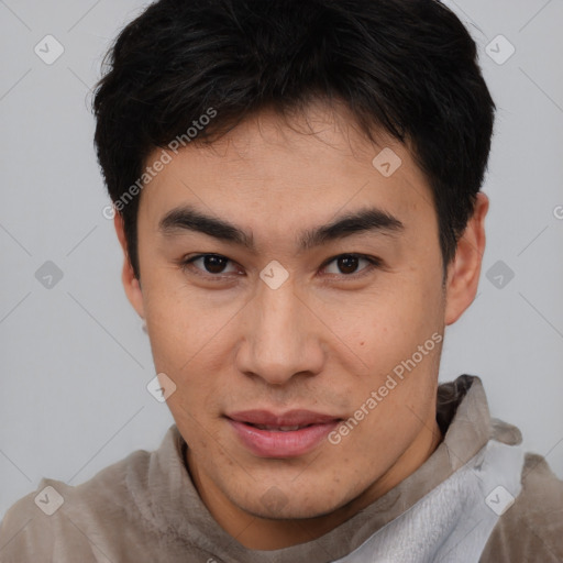 Joyful latino young-adult male with short  brown hair and brown eyes