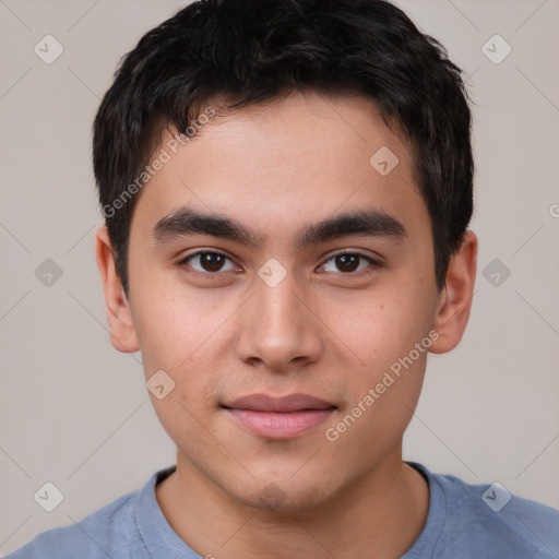 Joyful asian young-adult male with short  brown hair and brown eyes