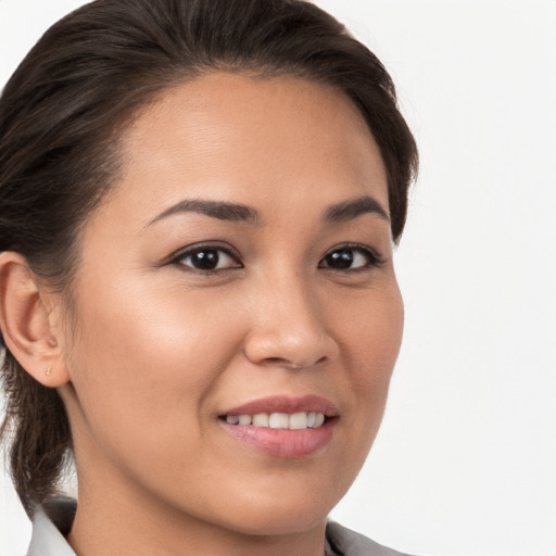 Joyful white young-adult female with medium  brown hair and brown eyes